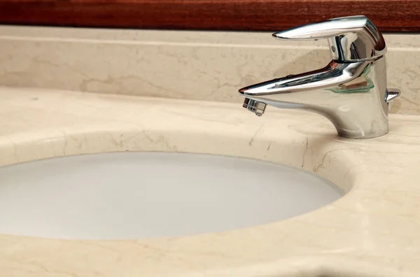 Faucet and marble sink — Stock Photo, Image