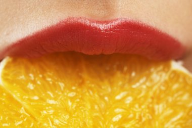 Beautiful lips, delicious orange