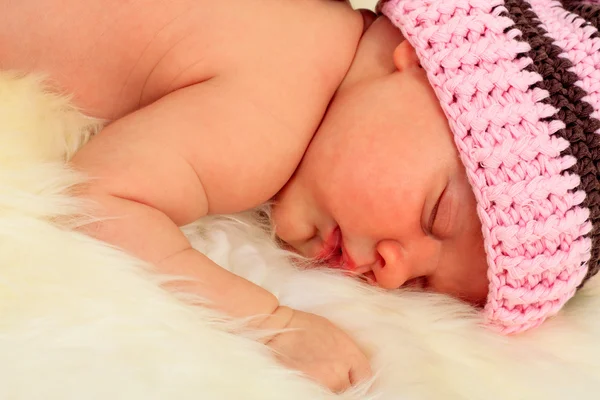 stock image Infant sleeping in the white sheep's clothing.