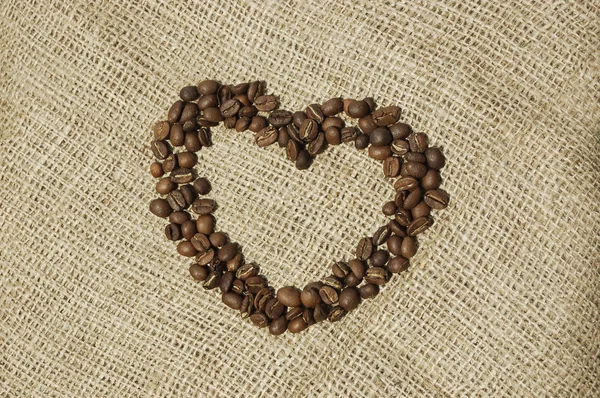 Hart van koffie over doek — Stockfoto