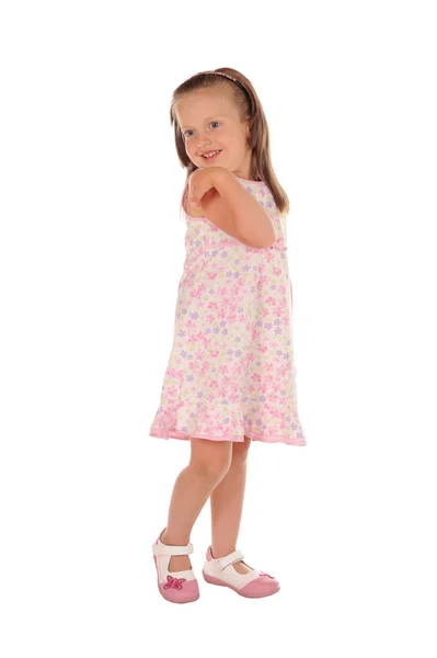 Kleines Mädchen posiert und lächelt — Stockfoto