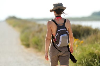 Woman walking in nature clipart