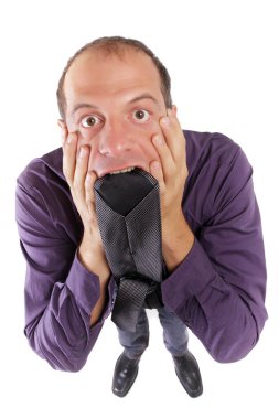 Frustred business man biting necktie clipart