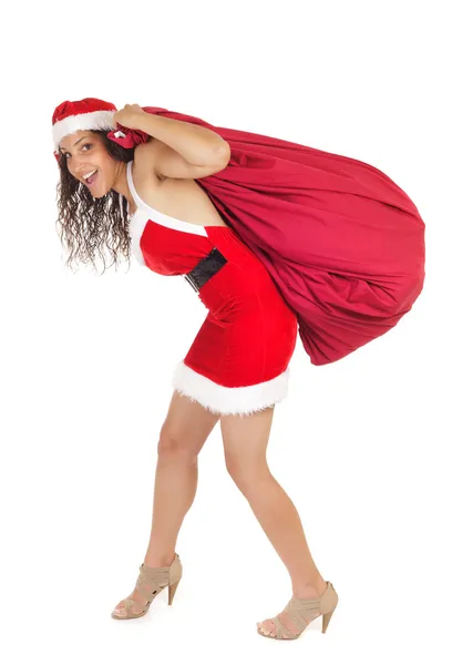 Santa claus woman carrying bag — Stock Photo, Image