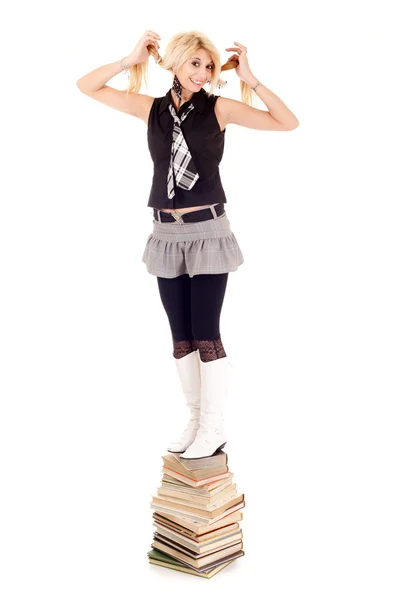 Schoolgirl on books — Stock Photo, Image