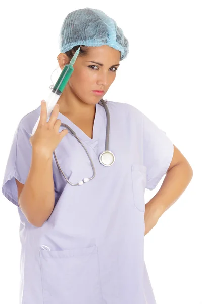 Ameaçador enfermeira segurando agulha — Fotografia de Stock