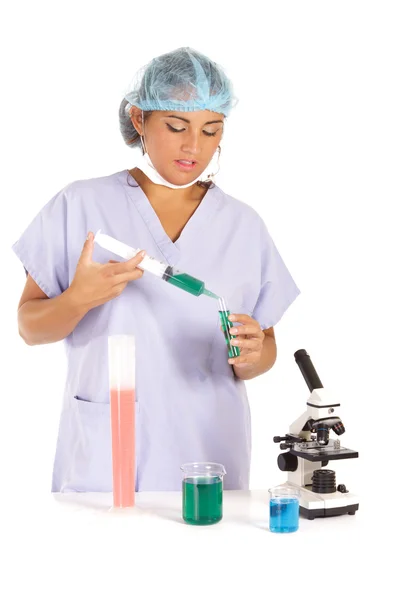 Scientist mixing liquids — Stock Photo, Image