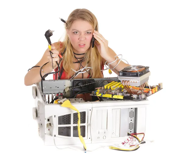 Upset woman repairing computer — Stock Photo, Image
