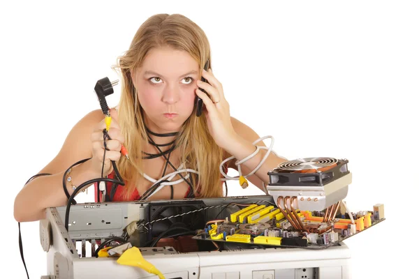 Bored woman repairing computer — Stock Photo, Image