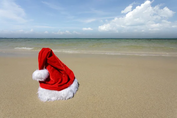 Santa hat on tropical beach Stock Picture