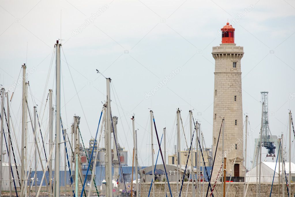 Lighthouse and boat mast