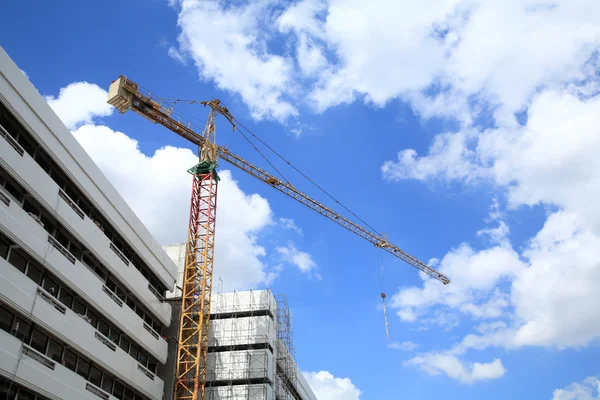 Yellow crane against blue sky and cloud — Stock Photo, Image