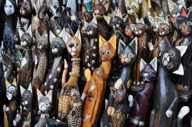 Wooden cats - carved figurines clipart