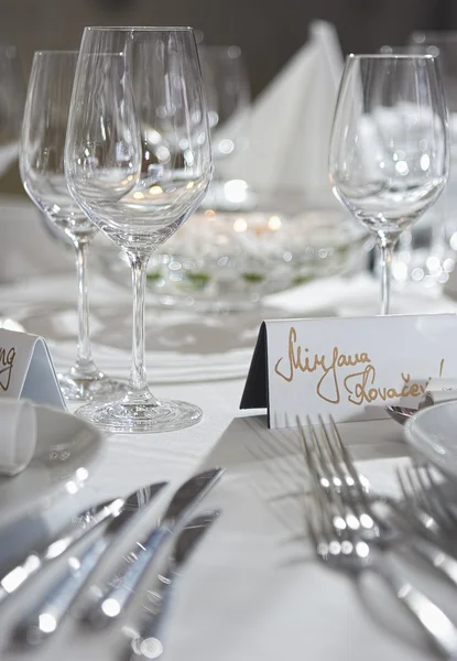 Fancy table set for a wedding party event dinnerand card on a ta — Stock Fotó