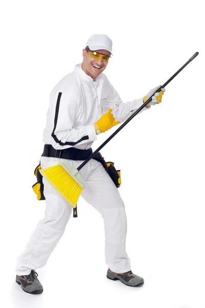Worker goes crazy with a broom guitar — Stock Photo, Image