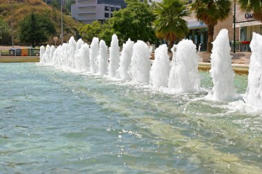 Water fountain and small pond clipart