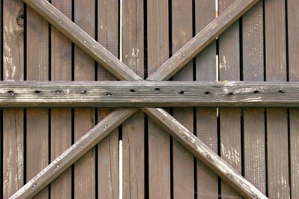 Wooden wall with a cross — Stock Photo, Image