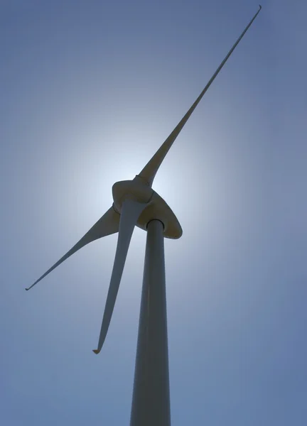 Wind mill power generator backlit vertical perspective — Stock Photo, Image