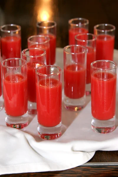 Several shot glasses with red drinks — Stock Photo, Image