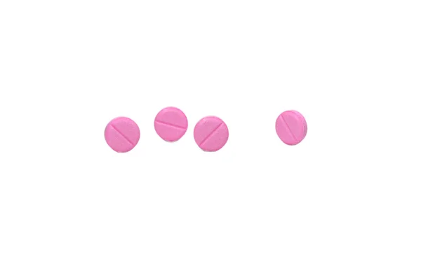 Vier roze pillen Stockfoto