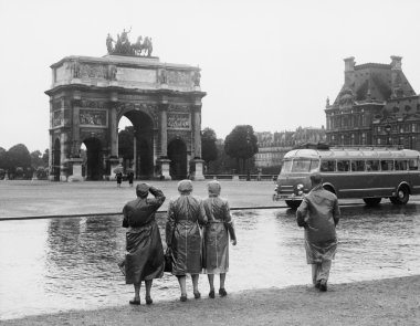 Tourists viewing the Arc de Triomphe du Carrousel at the Tuileries Gardens, July 15, 1953 clipart