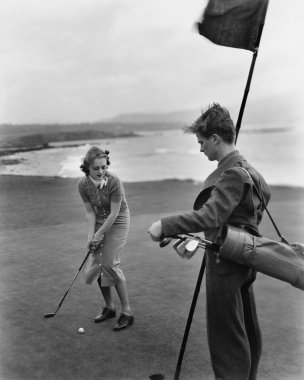 Golfing on the coast clipart