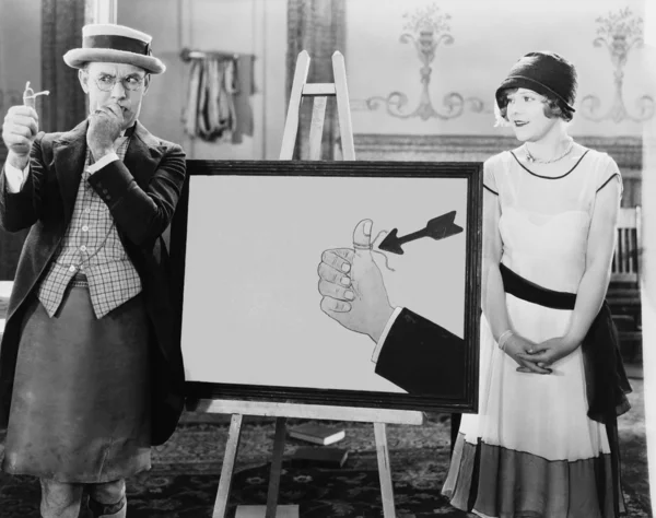 Γυναίκα βλέποντας στοχαστικό άνθρωπο με συμβολοσειρά που συνδέεται με το δάχτυλό του — Φωτογραφία Αρχείου