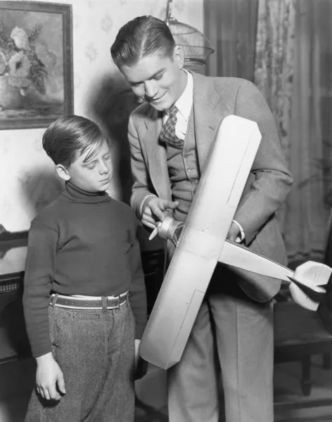 Brothers with model airplane — Stock Photo, Image