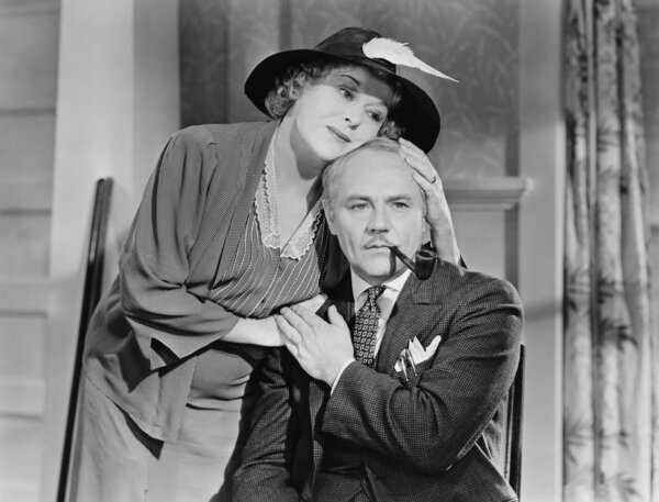 Woman comforting man smoking pipe