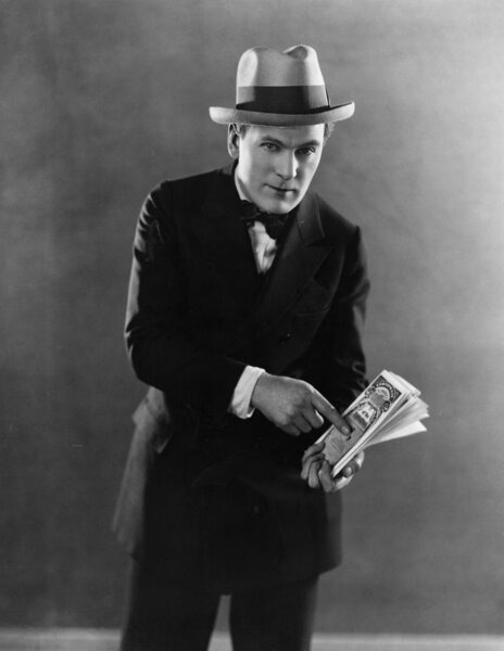 Portrait of man with stock certificates