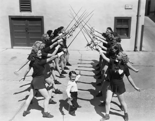 Teenage girls and little boy fencing — Stock Photo, Image