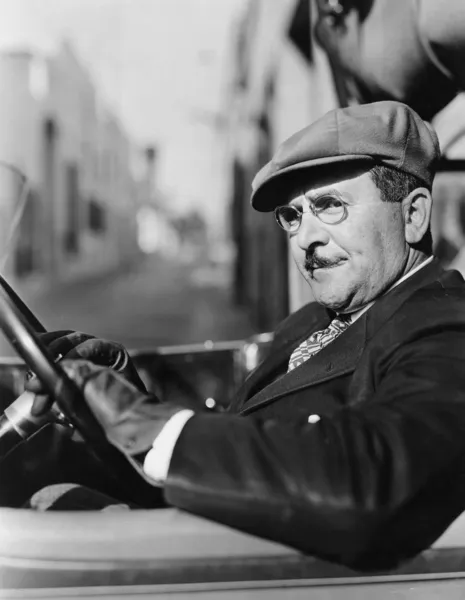 Portrait of man in drivers seat of car Stock Picture