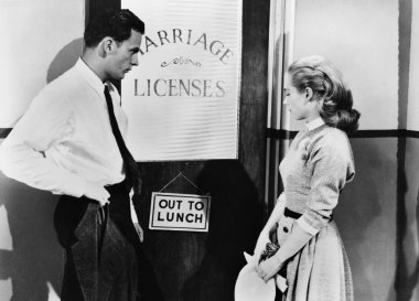 Couple waiting outside marriage license office clipart