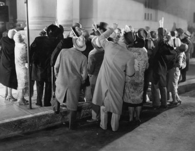 Crowd in street looking up clipart