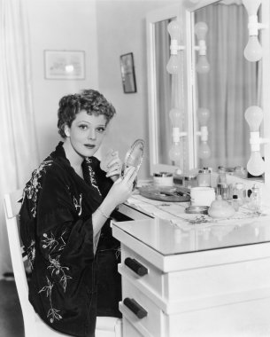 Portrait of woman at dressing table clipart