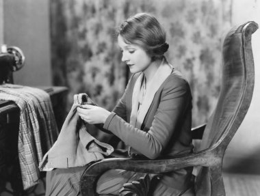 Portrait of woman sewing clipart