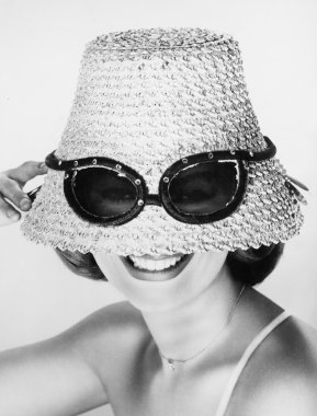 Woman wearing hat with fake sunglasses clipart