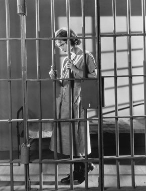 Woman in jail cell clipart