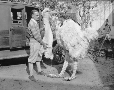 Men with ostrich costume clipart