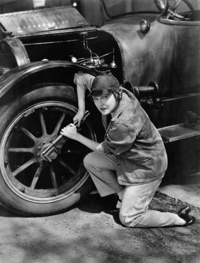 Portrait of female mechanic working clipart