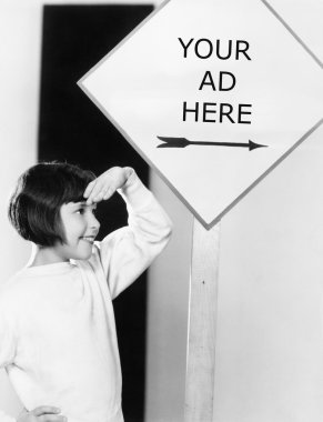 Profile of a young girl shielding her eyes under an information board clipart