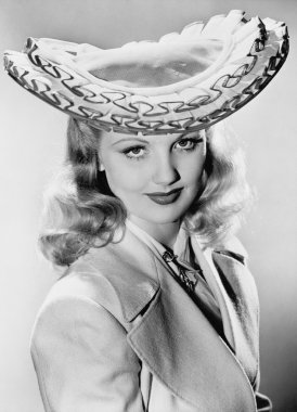 Young woman wearing her exotic hat clipart