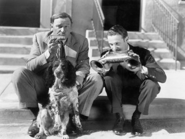 Two men playing two harmonicas with an English Setter clipart