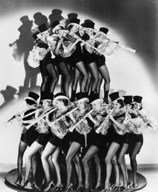 Women in costumes performing a clarinet concert clipart