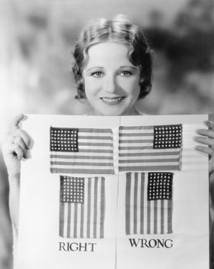 Young woman holding a diagram of how to hang an American Flag clipart