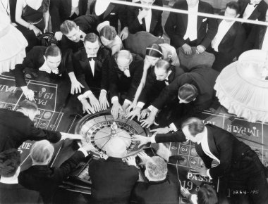 High angle of a group of playing roulette clipart