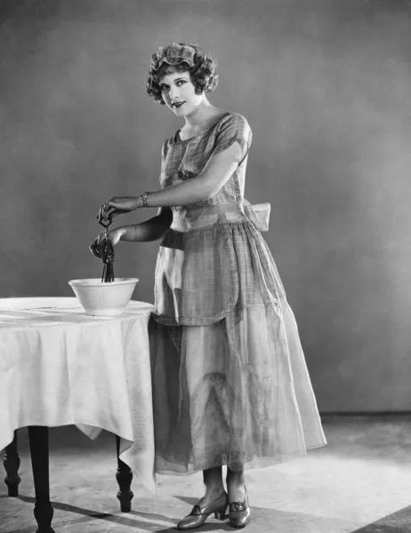 Woman using eggbeater — Stock Photo, Image