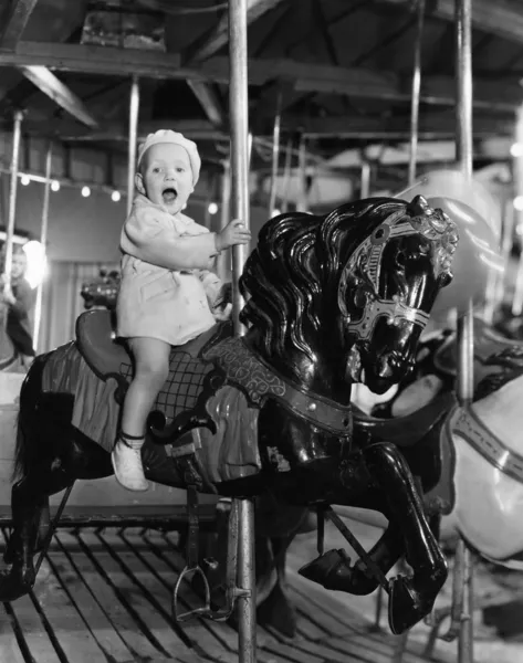Criança em carrossel — Fotografia de Stock