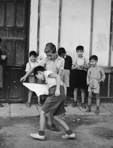 stock image Kids playing bullfighting game in street