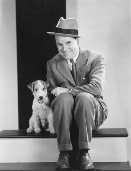 Portrait of man with puppy